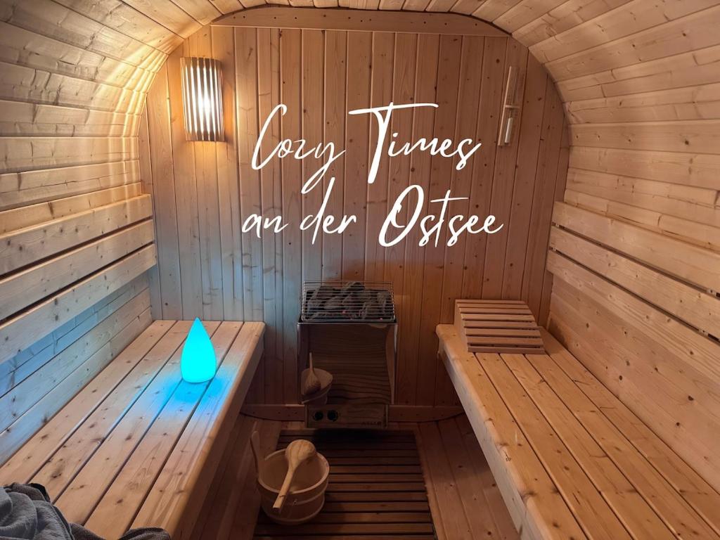 a sauna with a sign that reads every time an ever office at Ferienwohnung Birklund in Probsteierhagen