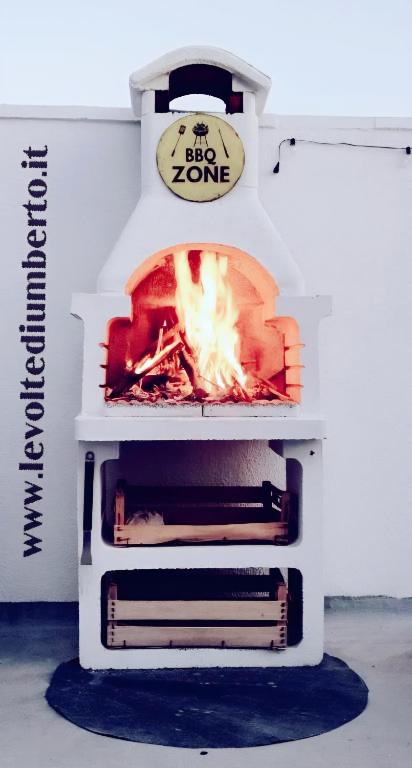 a stove with a fire inside of it at Le volte di Umberto Scirocco in Sogliano Cavour