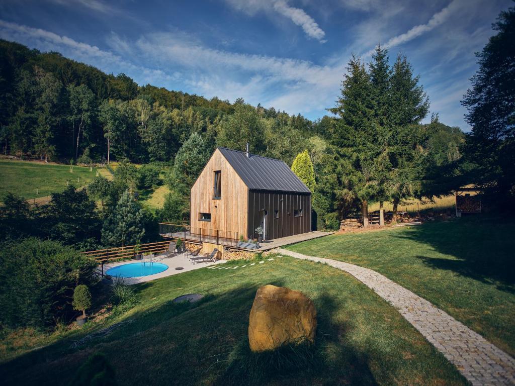 an overhead view of a barn with a pool at Chalet Plechovka in Frýdštejn