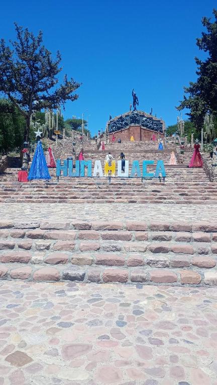 a set of stairs with a sign that says what a mess at Casa Ayres de la Quebrada in Humahuaca