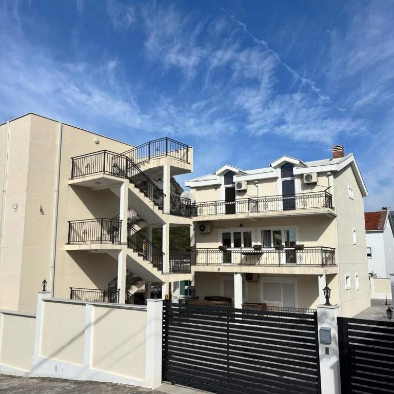 a building with balconies on the side of it at Vila Seawolf Apartments in Sutomore