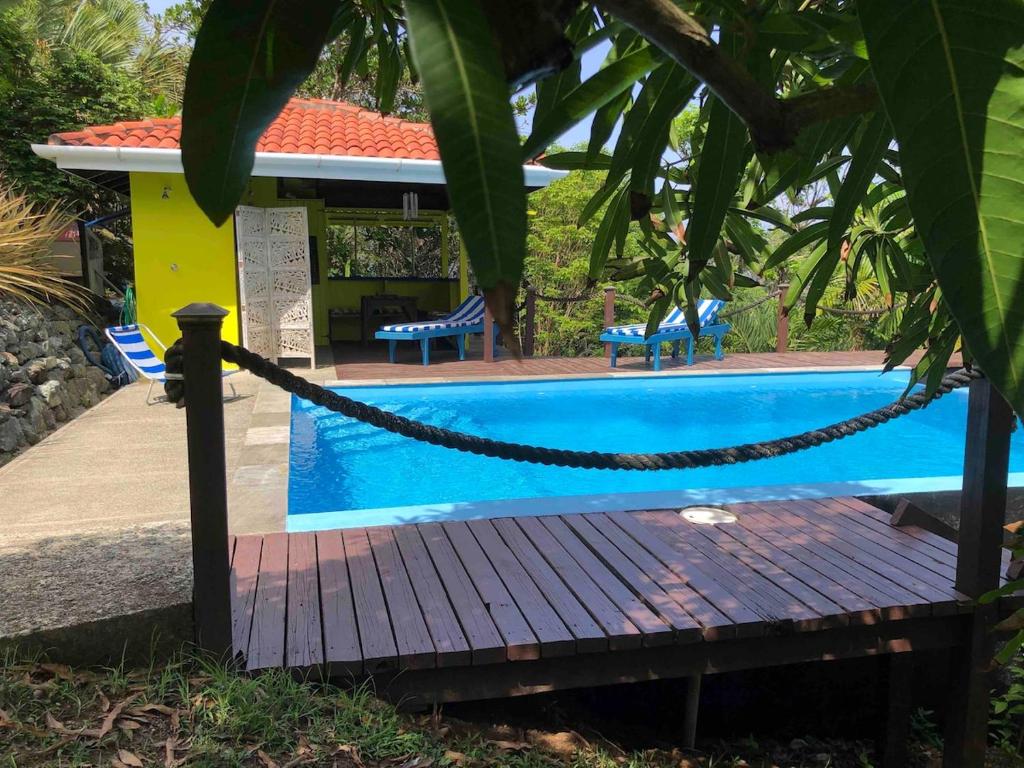 a swimming pool with a chain around it at Beautiful Cottage overlooking Sea in Goodwood