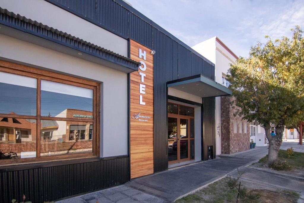 a facade of a building with a storefront at Hotel Americano in Perito Moreno