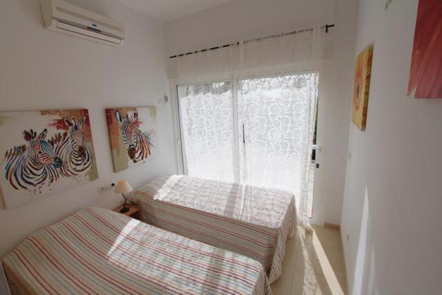 Postel nebo postele na pokoji v ubytování Villa Quinto Pino