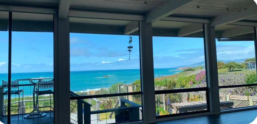 a view of the ocean from a house at Bodega Bay Magical Ocean Front w/Amazing View! in Bodega Bay
