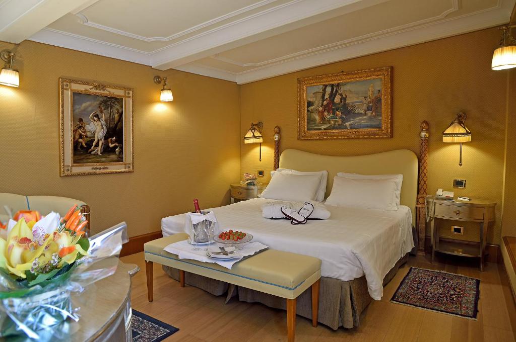 Postel nebo postele na pokoji v ubytování Hotel Homs
