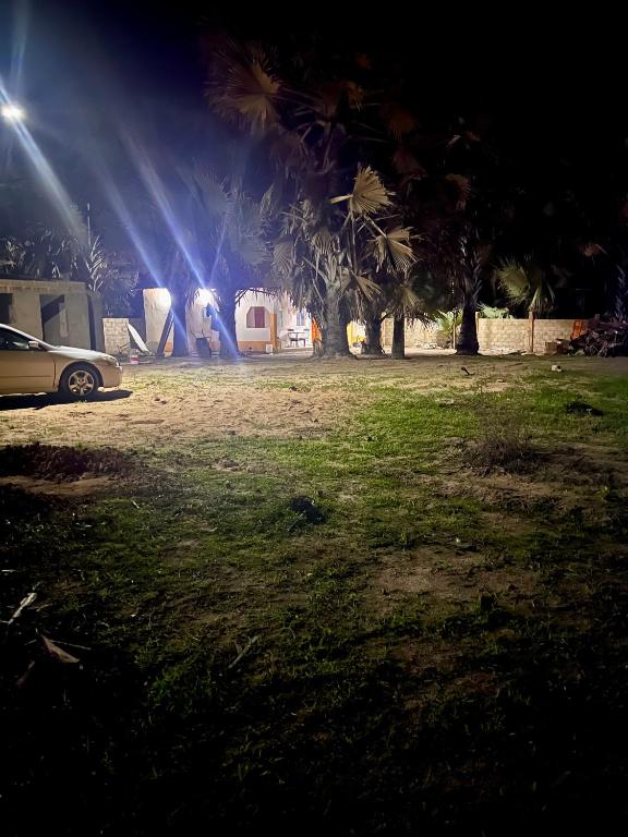 a car parked in front of a house at night at Baraka Nema Villa Resorts in Gunjur