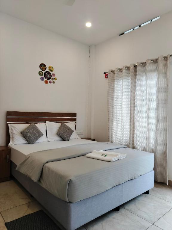 a bedroom with a large bed in a room at Asprin Homestay in Munnar