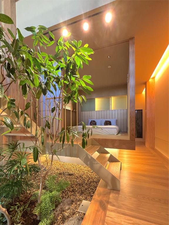 a bedroom with a bed in a room at NEW2025! Shirakaba ROKUI 白樺 緑居 Architect-designed Luxury Villa with Concierge Service in Osaka