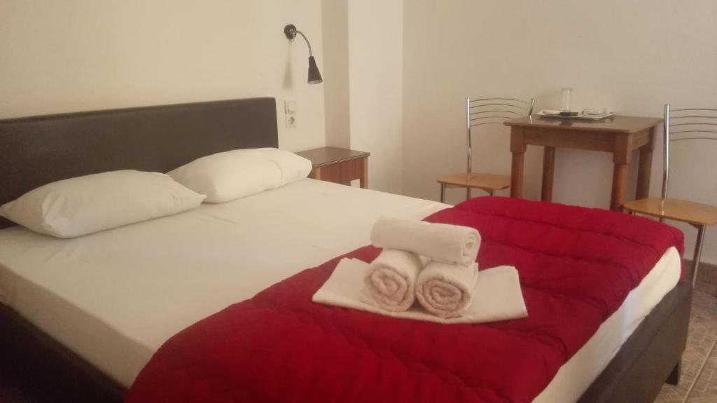 Postel nebo postele na pokoji v ubytování Hotel Ionion