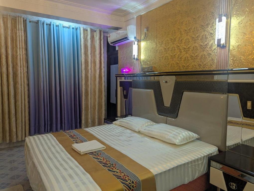a hotel room with a bed in a room at Ontrack Travel - room in Male City