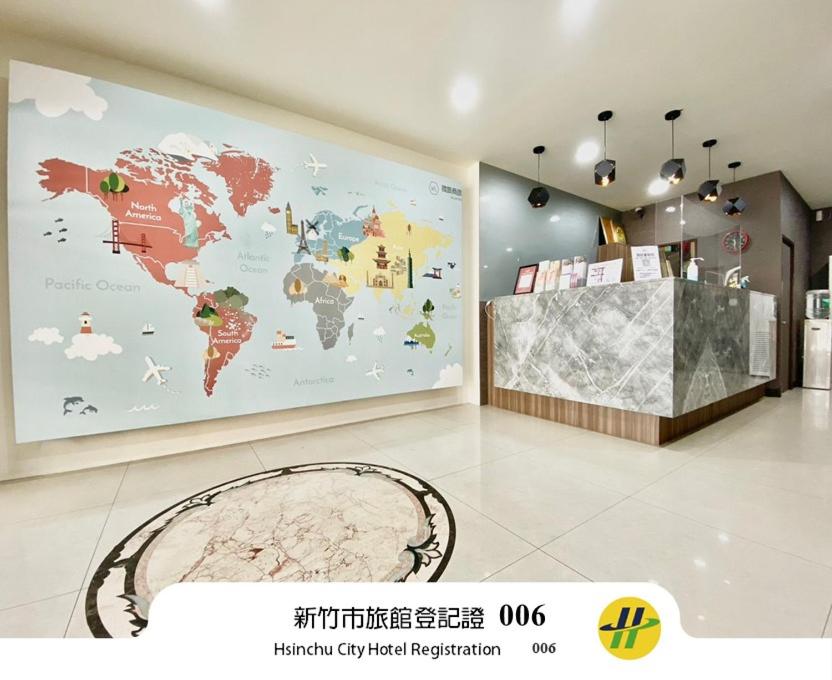 a room with a map of the world on the wall at WL HOTEL Hsinchu in Hsinchu City