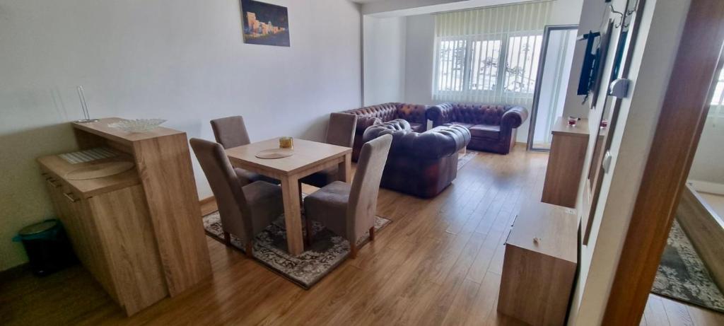 a living room with a small table and chairs at Gondola Mako Exclusive in Zlatibor