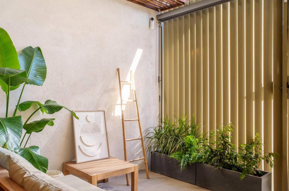 a room with plants and a ladder and a couch at Mestalla flats & Rut in Valencia