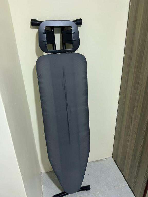 a black object is hanging on a wall at Gracious homes in Narok