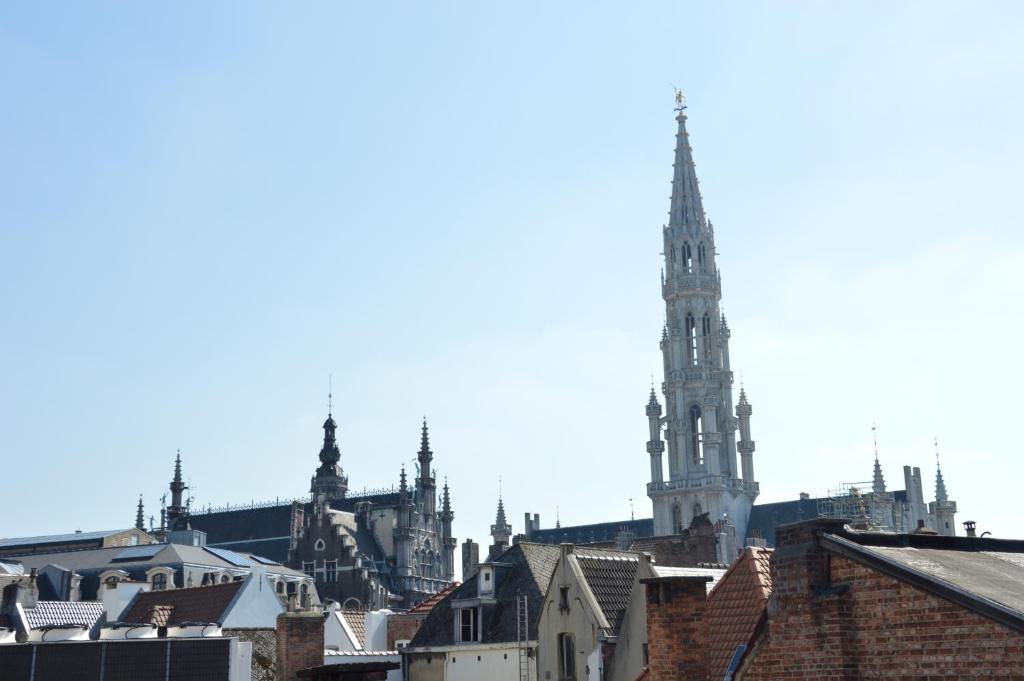 a view of a city with a tall cathedral at Flat Sympa next Grand Place in Brussels