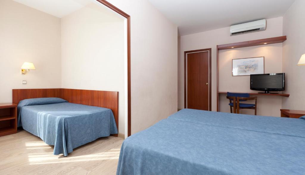 Postel nebo postele na pokoji v ubytování Peninsular