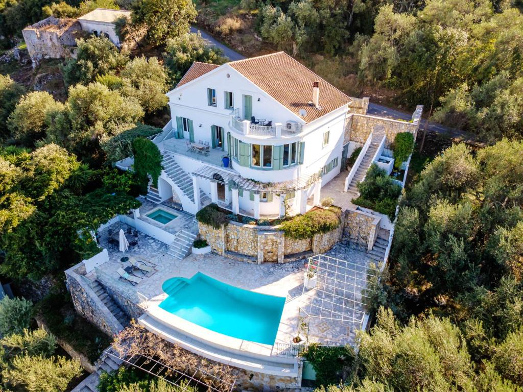 an aerial view of a house with a swimming pool at Eagle's Rest Villa in Kassiopi