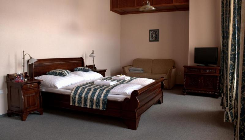 Postel nebo postele na pokoji v ubytování Hotel na Kafkové