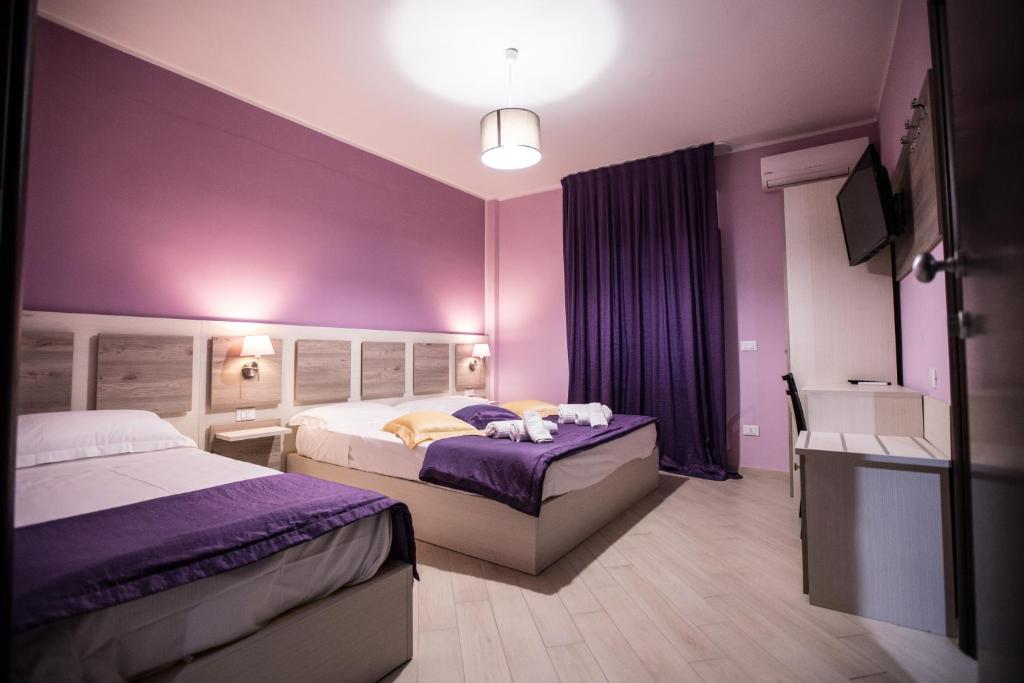 Postel nebo postele na pokoji v ubytování Hotel Cliché