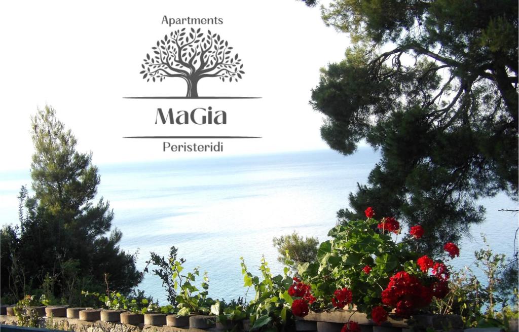a sign for a garden with a tree and flowers at MaGia Peristeridi in Polychrono