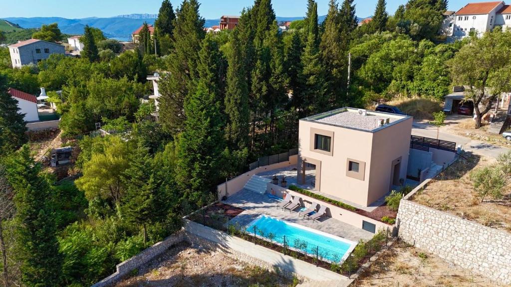 an aerial view of a house with a swimming pool at Villa D Cube in Kremena