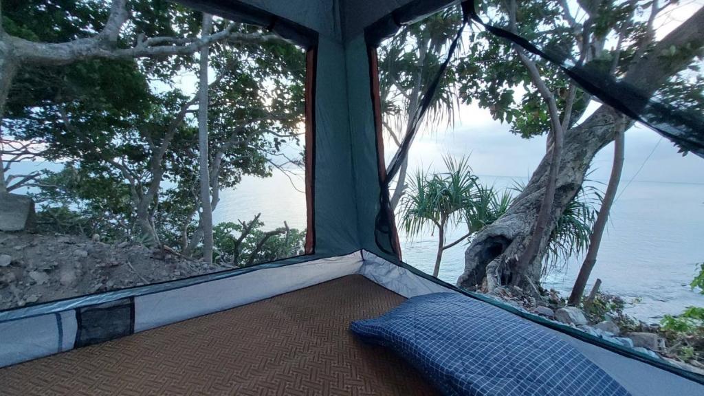 a room with a bed with a view of the ocean at Coco Tent Seaview 360 in Ko Lanta