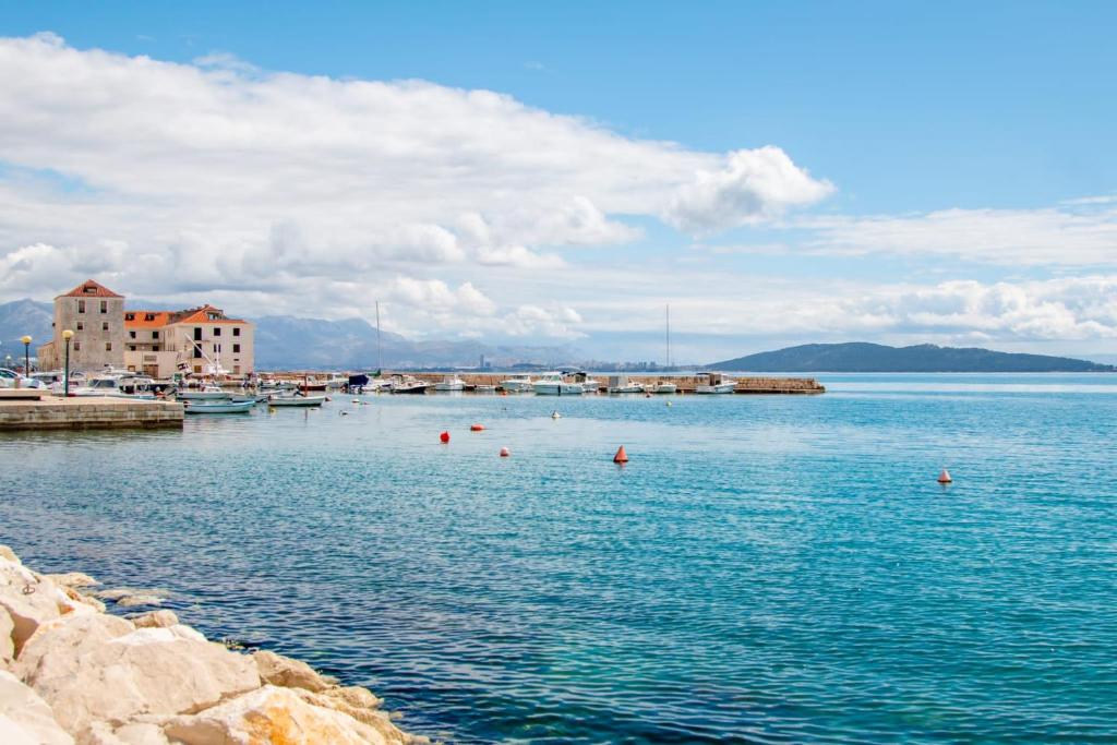 a large body of water with boats in it at Studio apartman Relota in Kaštela