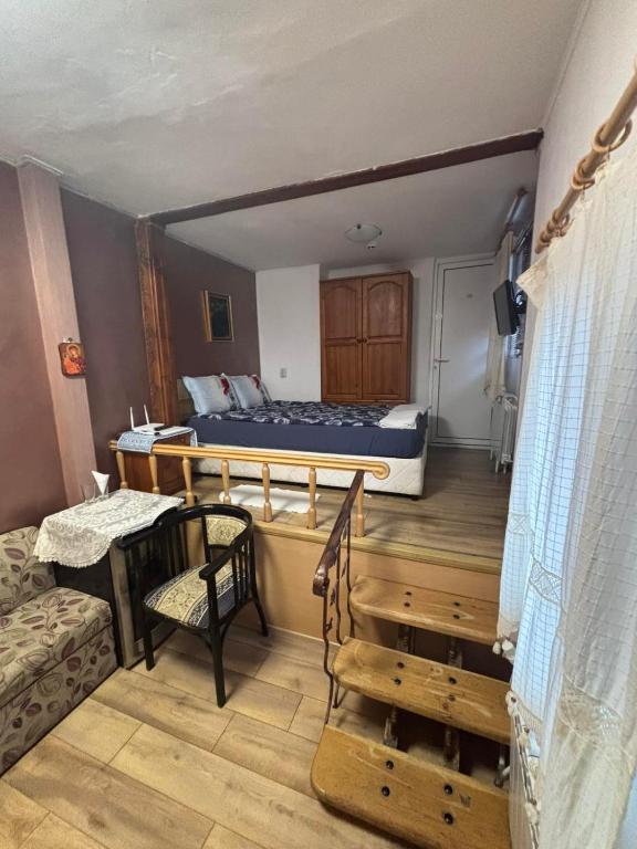 a room with a bed and a table and a couch at dato in Arbanasi