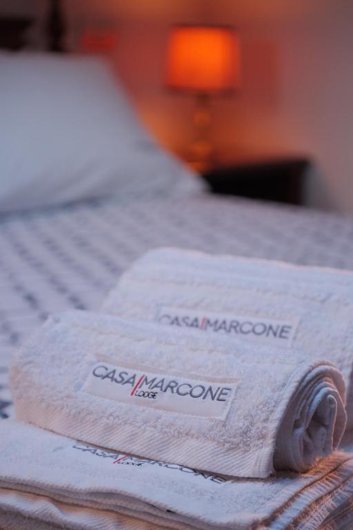 two towels are sitting on top of a bed at Casa Marcone in Deiva Marina