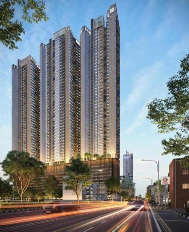 a city with tall buildings and cars on a street at TriZen Luxe Apartments in Colombo