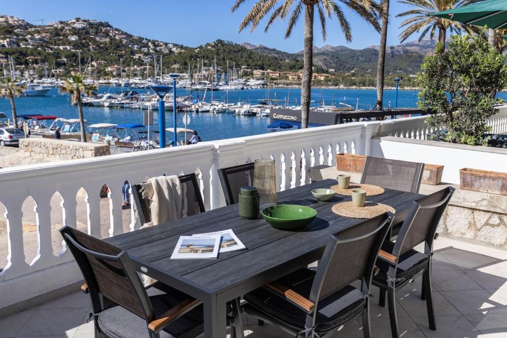a table on a balcony with a view of a marina at Ca Sa Joia - Beautiful Views in Port d'Andratx