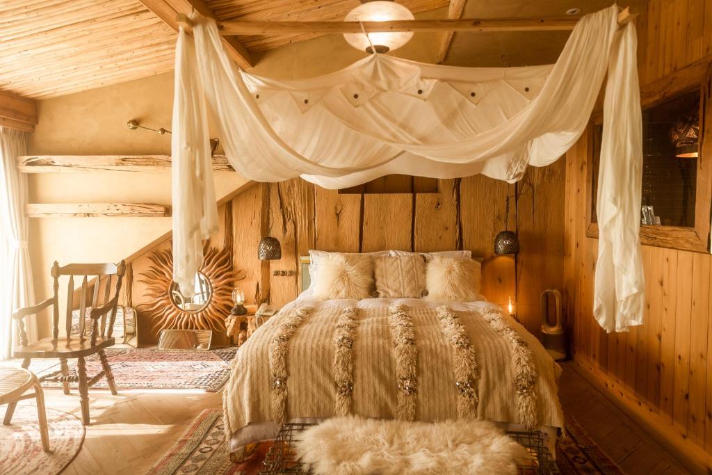 a bedroom with a bed with a canopy at Impression Nordic Manor Club in Ren'ai