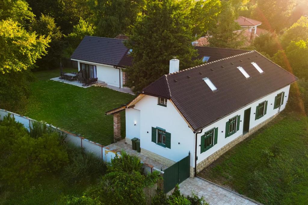 an aerial view of a white house with a brown roof at DOM na konci in Kostolné