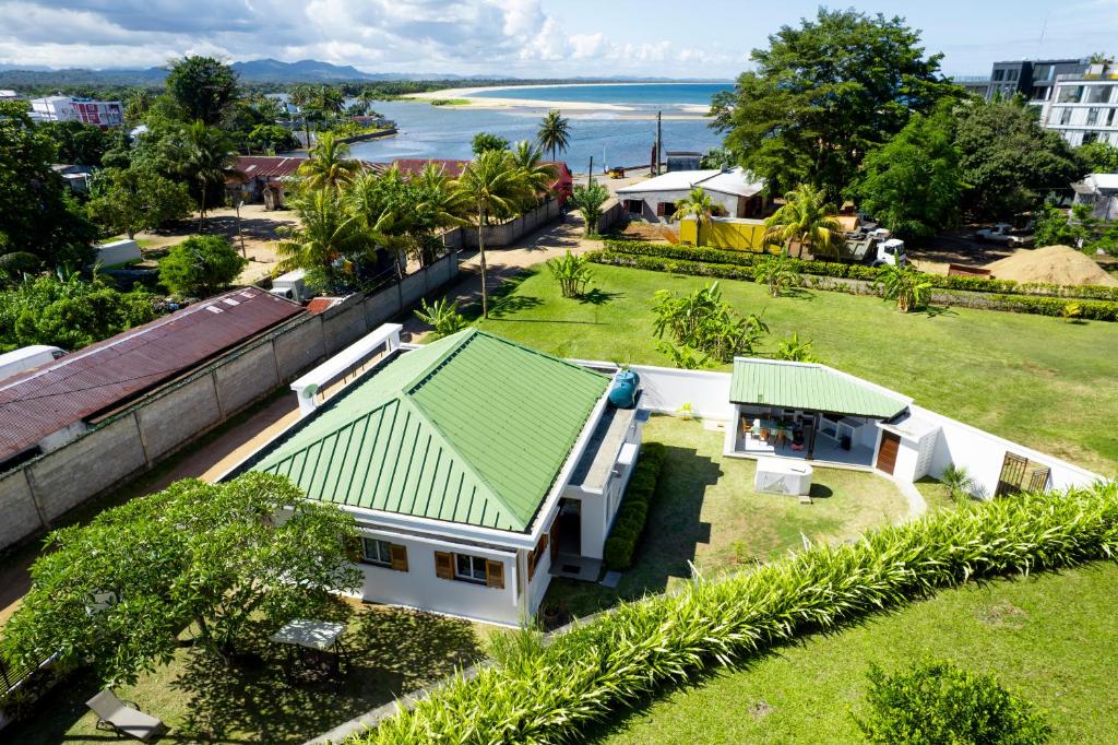 an aerial view of a house with a green roof at Maison d'hôte Chez Vané in Sambava