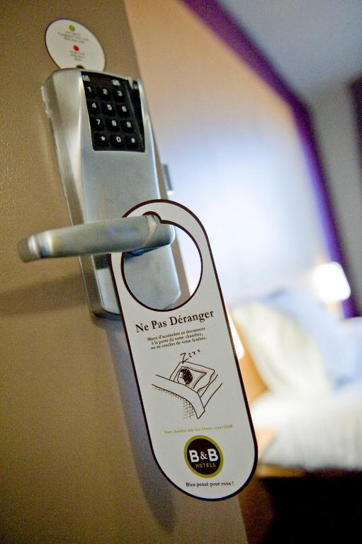 Postel nebo postele na pokoji v ubytování B&B HOTEL Dijon Nord Zénith