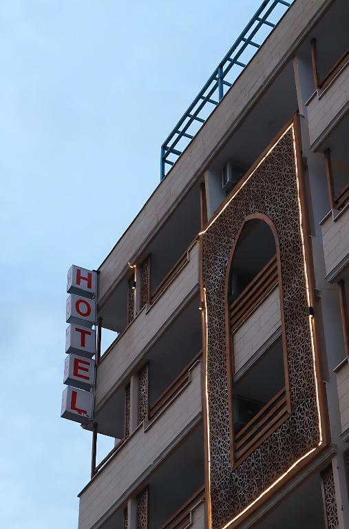a building with a sign on the side of it at Mariam Economy Hotel in Aqaba