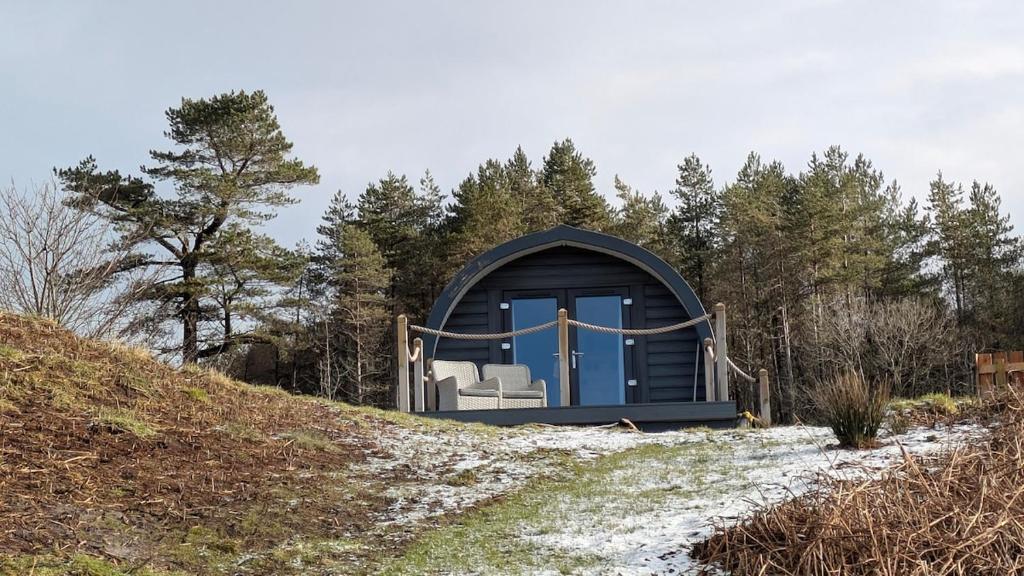 a small dome house on a snow covered hill at Herons Rest Pod By The Sea in Morar Station