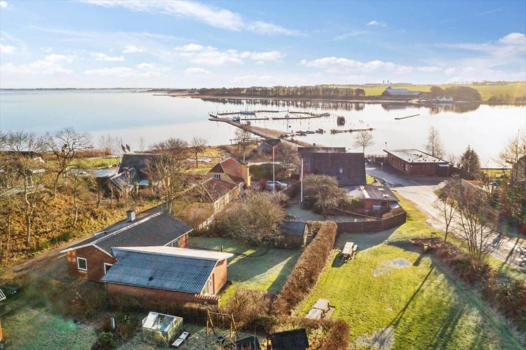 an aerial view of a house next to a body of water at LF10313-Hurup-Thy-Fjordstraede-13 in Doverodde
