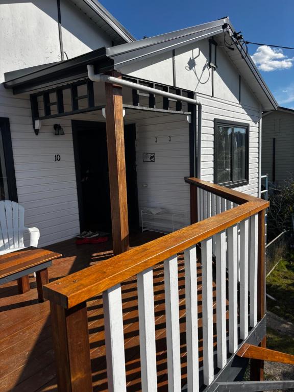 a deck with awning on a house at Maydena Chalet in Maydena