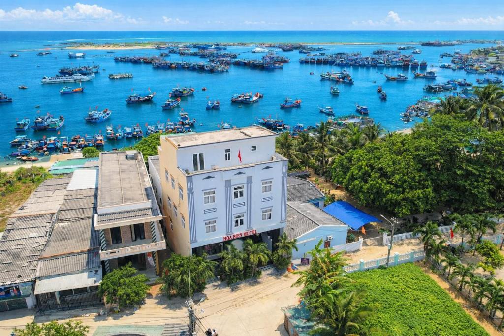 an aerial view of a harbor with boats in the water at Hoa Bien Motel in Ly Son