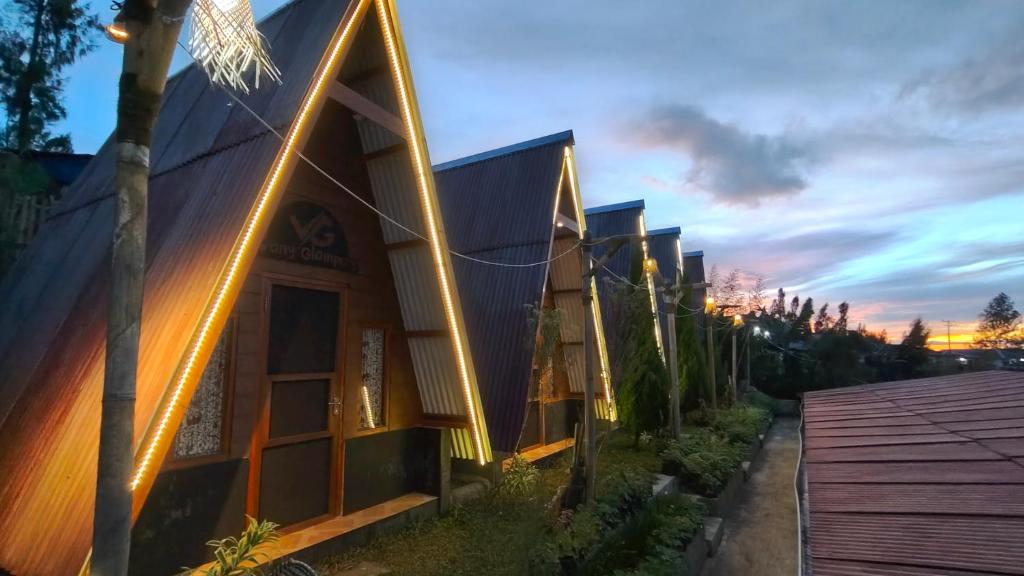 a building with lights on the side of it at VANY Glamping in Pasuruan