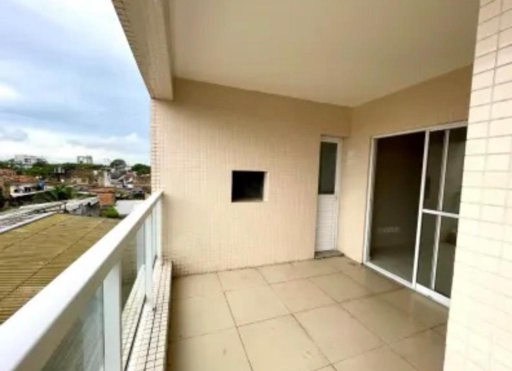 a balcony with a view of a building at Apto 204 in Barcarena