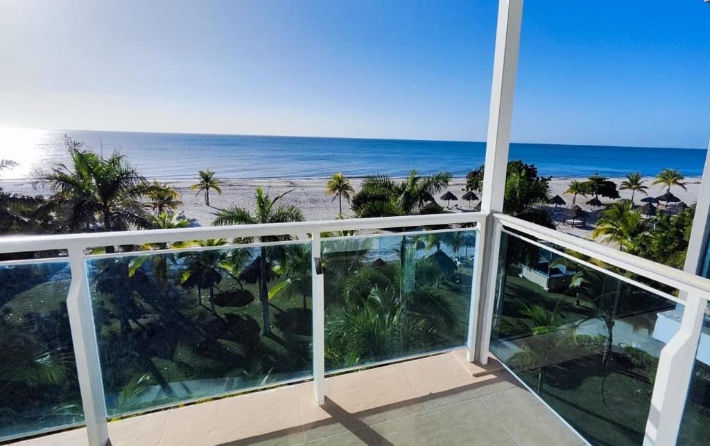 a view of the beach from the balcony of a resort at Nikki Beach Oceanfront Penthouse in Río Hato