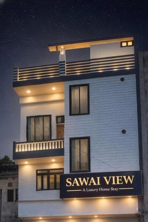 a large white building with a sign on it at Hotel Sawai View in Sawāi Mādhopur
