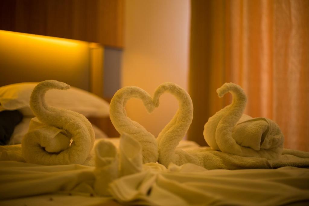 Postel nebo postele na pokoji v ubytování Kuredhi Beach Inn