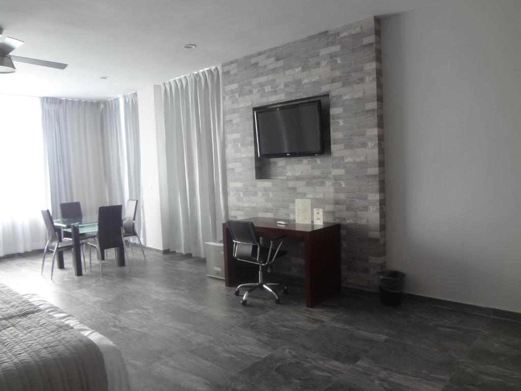 TV a/nebo společenská místnost v ubytování Hotel Civic Express