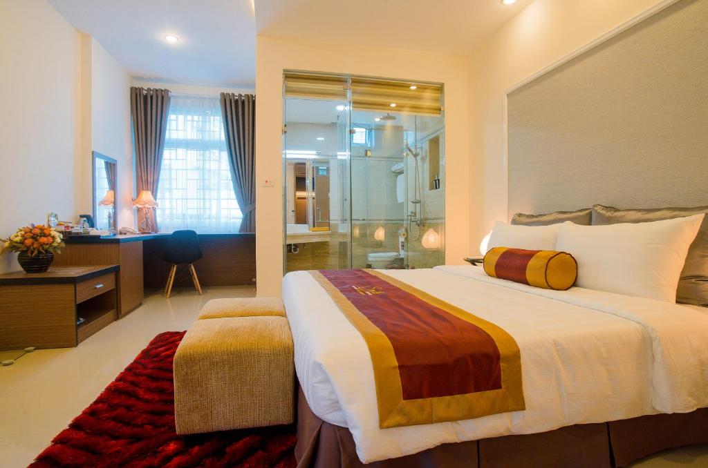 Postel nebo postele na pokoji v ubytování Smile Hotel