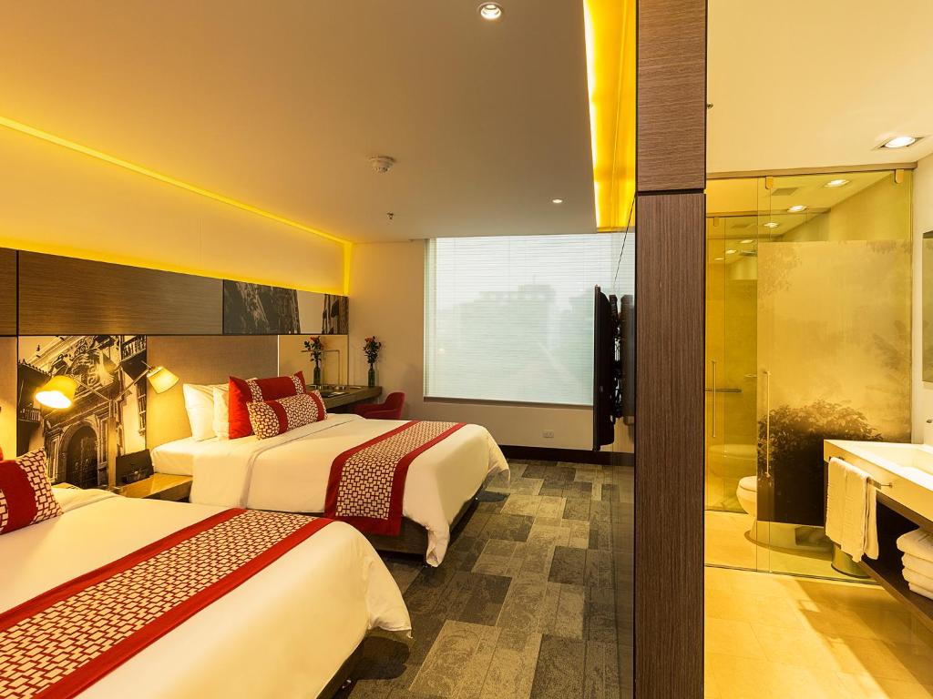 Postel nebo postele na pokoji v ubytování EK Hotel By Preferred Hotels Group