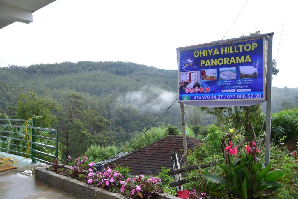 a sign with a view of a mountain at Hilltop Panorama Ohiya in Ohiya